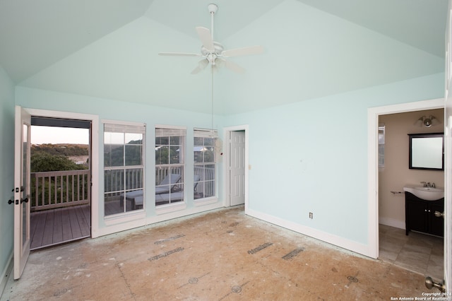 empty room with vaulted ceiling, ceiling fan, and sink