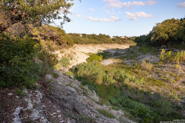 282 Hill Top, Lakehills, TX 78063 - view of mountain backdrop featuring a forest