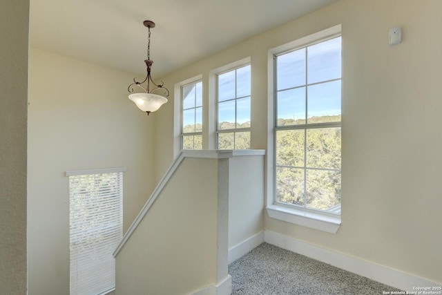 282 Hill Top, Lakehills, TX 78063 - staircase featuring plenty of natural light, baseboards, and carpet