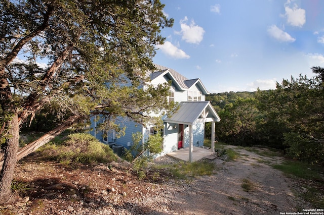 view of front of home featuring central air condition unit