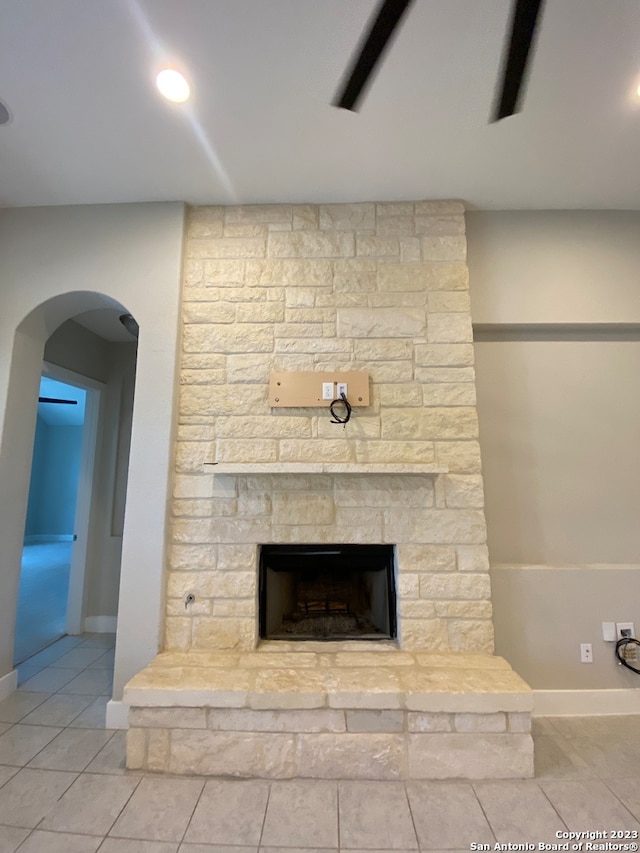 room details with tile patterned flooring and a fireplace