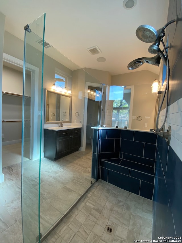 bathroom featuring vanity and walk in shower