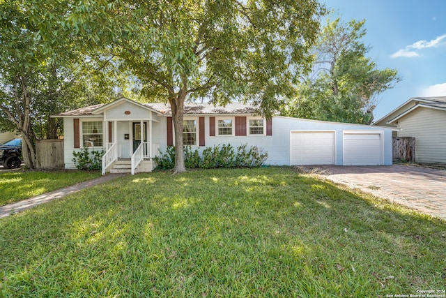 single story home featuring a garage and a front lawn