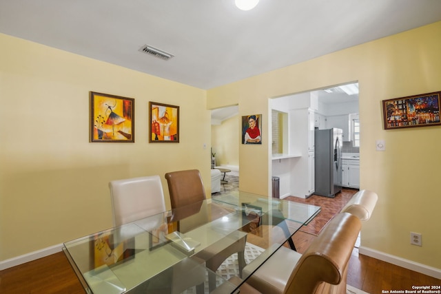 dining area with hardwood / wood-style floors