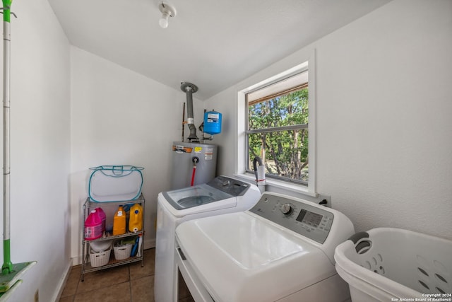 laundry room with independent washer and dryer, water heater, and tile patterned floors