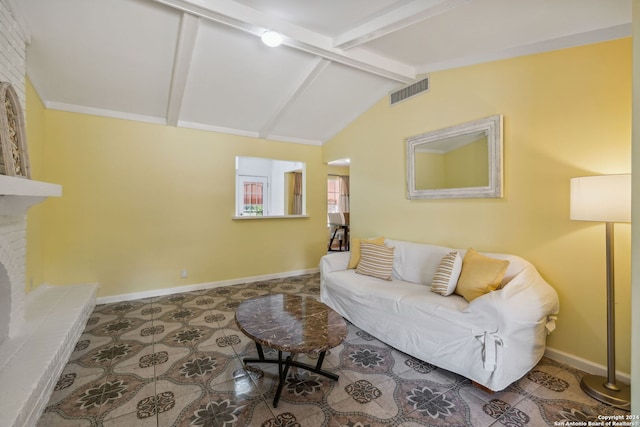 living room with lofted ceiling with beams and a brick fireplace