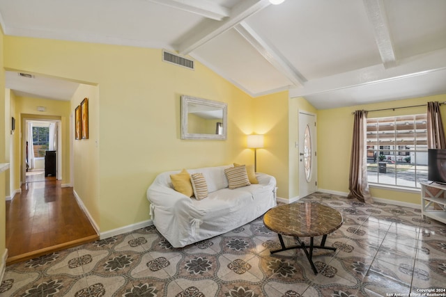 living room with vaulted ceiling with beams, hardwood / wood-style floors, and plenty of natural light