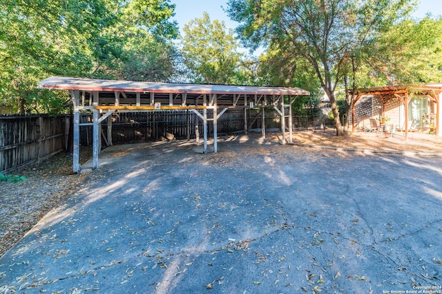 exterior space with a carport