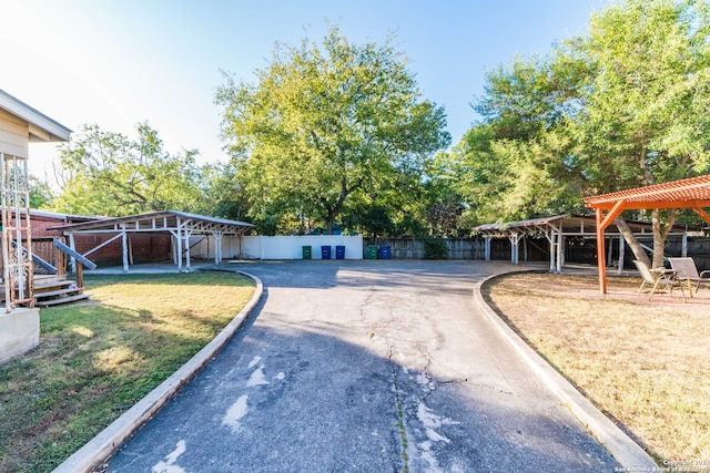 view of yard with an outbuilding and a carport