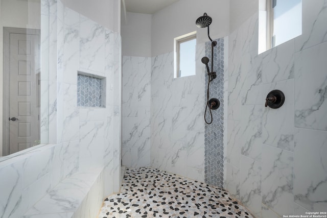 bathroom featuring a tile shower