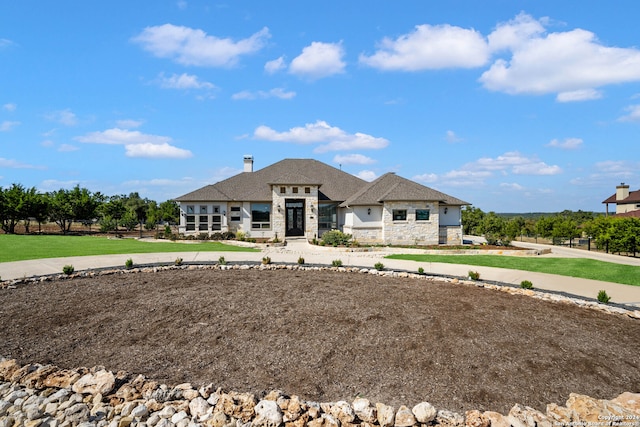 french country home with a front lawn