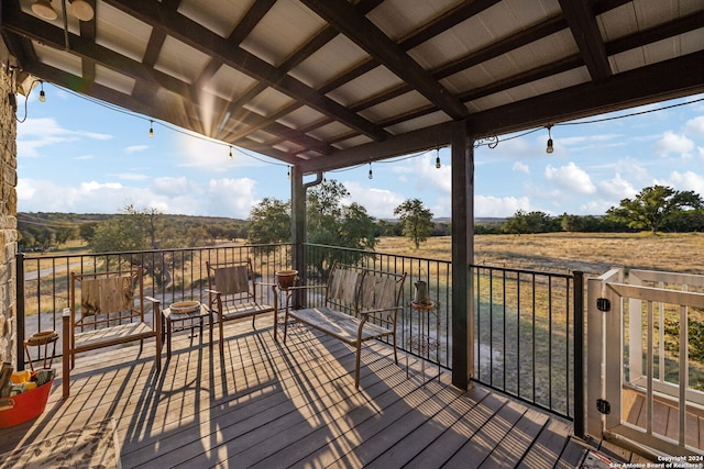 wooden deck featuring a rural view