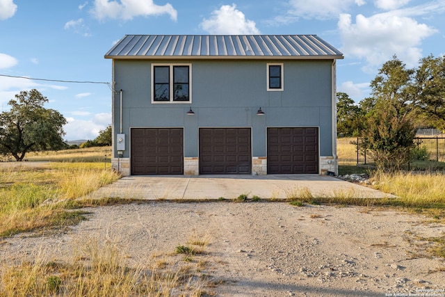 view of side of home featuring a garage