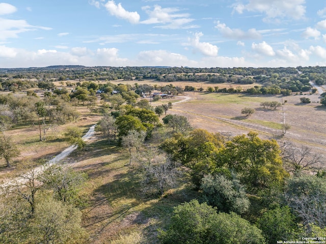 birds eye view of property featuring a rural view