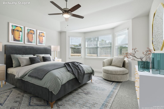 carpeted bedroom featuring ceiling fan