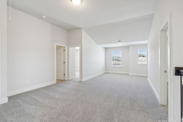 spare room featuring light colored carpet