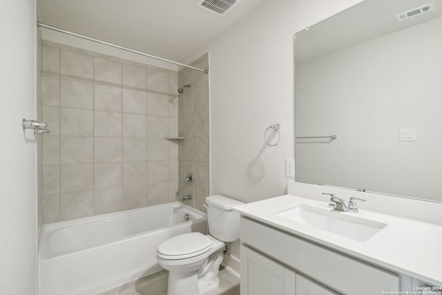 full bathroom featuring vanity, toilet, and tiled shower / bath combo