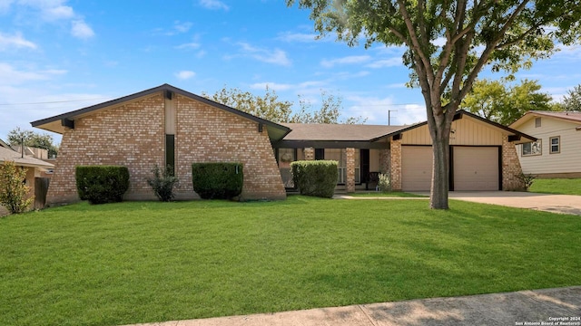 single story home with a garage and a front lawn