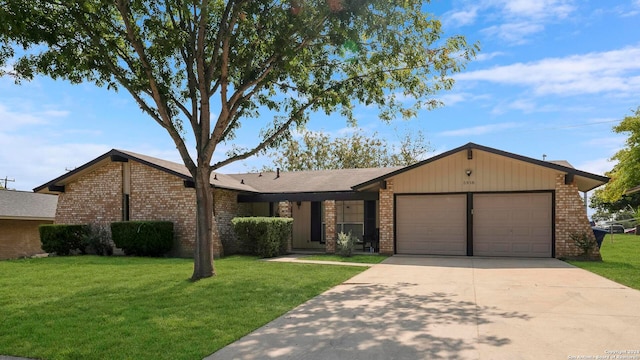 ranch-style house featuring a front yard and a garage