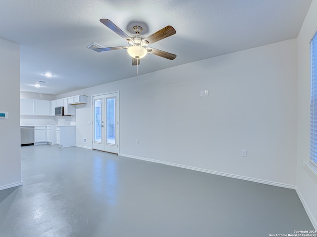 unfurnished living room with a textured ceiling and ceiling fan