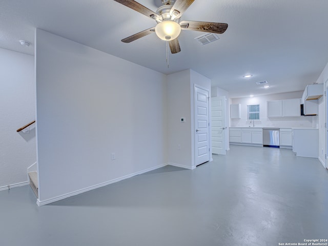 unfurnished living room featuring ceiling fan and concrete flooring