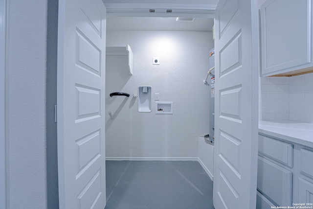 clothes washing area featuring water heater, washer hookup, and hookup for an electric dryer