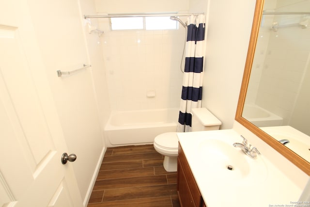 full bathroom with vanity, hardwood / wood-style flooring, toilet, and shower / bathtub combination with curtain