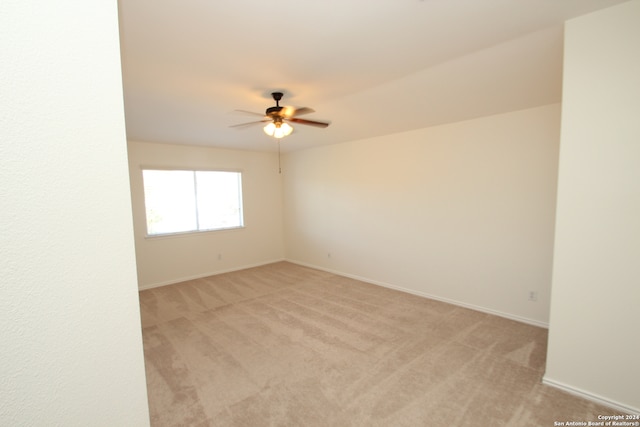 empty room with light carpet and ceiling fan