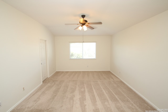 carpeted empty room with ceiling fan