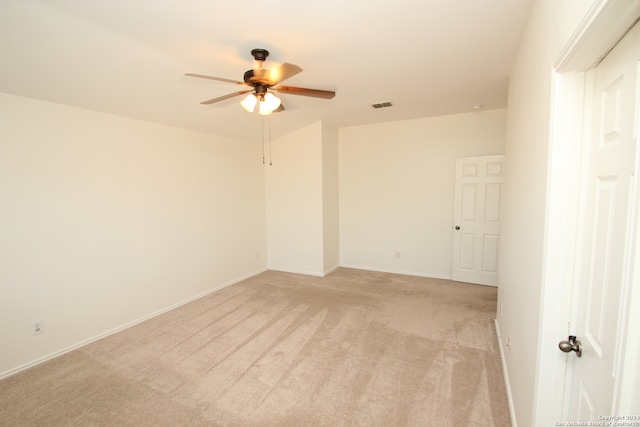 carpeted empty room with ceiling fan