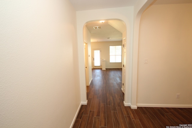 corridor with dark wood-type flooring