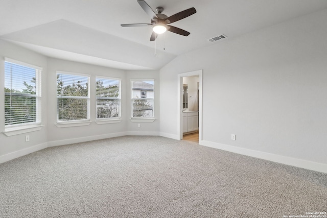 carpeted empty room with lofted ceiling and ceiling fan