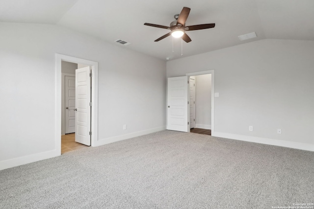 unfurnished bedroom with vaulted ceiling, light colored carpet, and ceiling fan