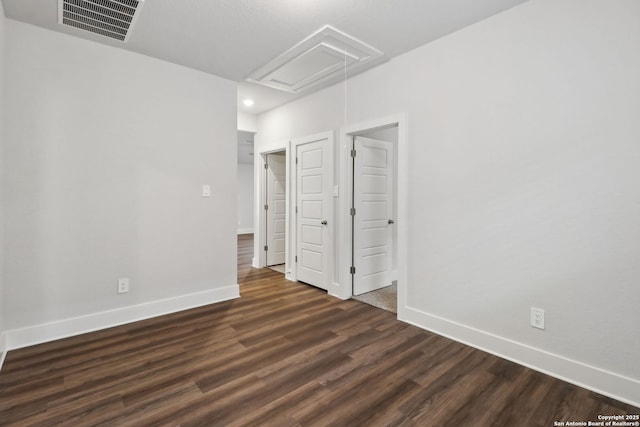 unfurnished room featuring dark hardwood / wood-style floors