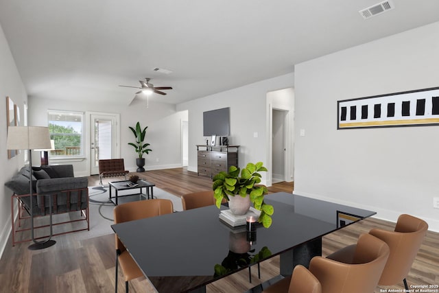 dining space featuring hardwood / wood-style floors and ceiling fan