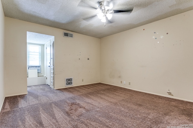 carpeted empty room with a textured ceiling and ceiling fan