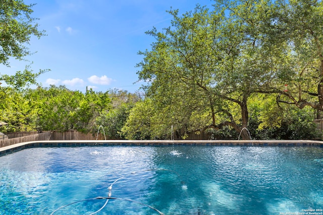 view of pool featuring pool water feature