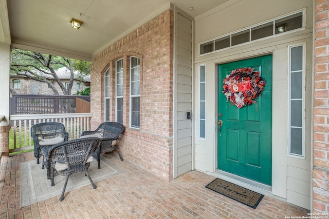 property entrance featuring a porch