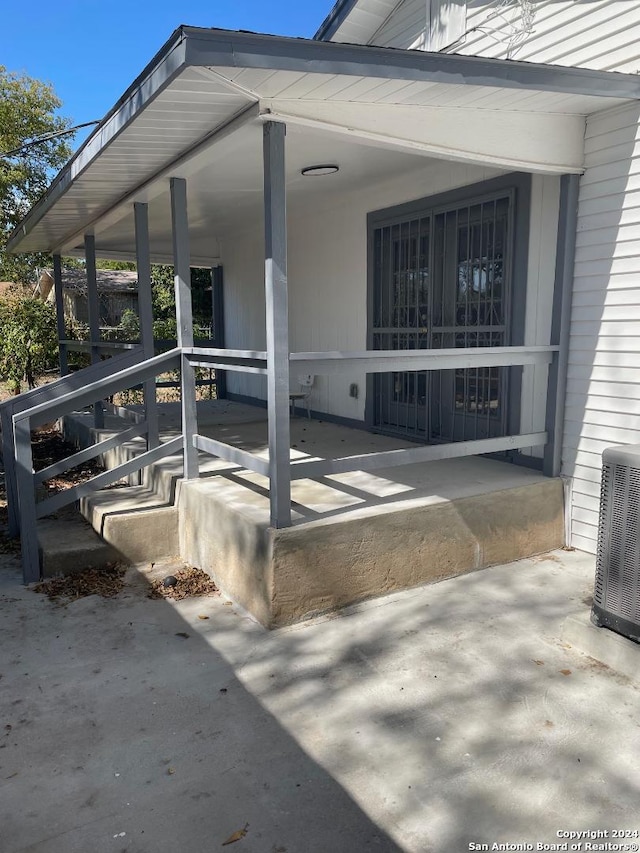 exterior space featuring covered porch and central air condition unit