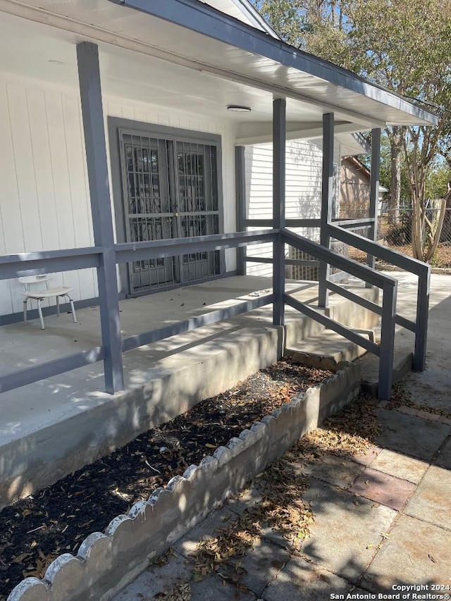 doorway to property featuring a porch