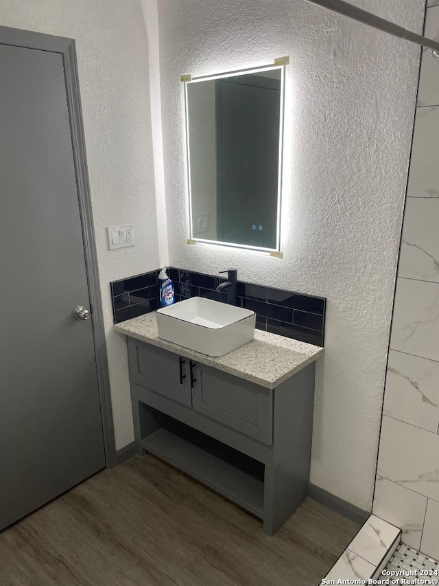 bathroom featuring vanity and wood-type flooring