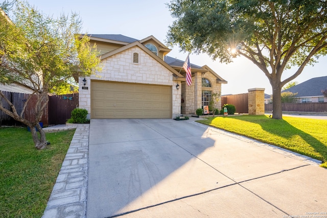 view of front facade featuring a garage and a front lawn