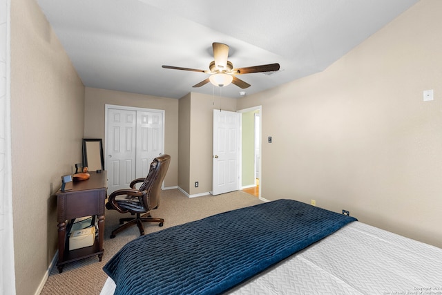 bedroom with a closet, ceiling fan, and carpet