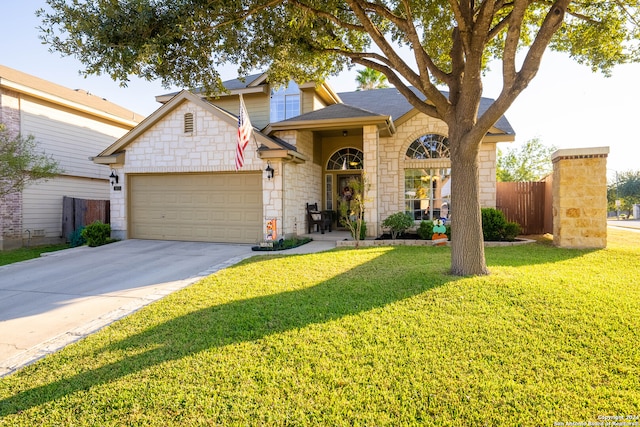 view of front of home with a front lawn and a garage