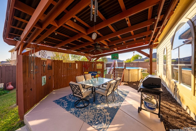 view of patio with a grill and ceiling fan