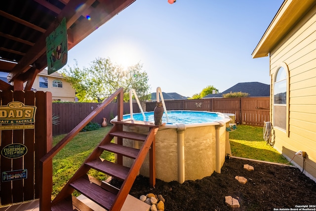 exterior space with a fenced in pool