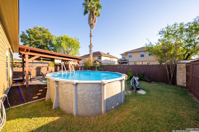 view of pool with a lawn