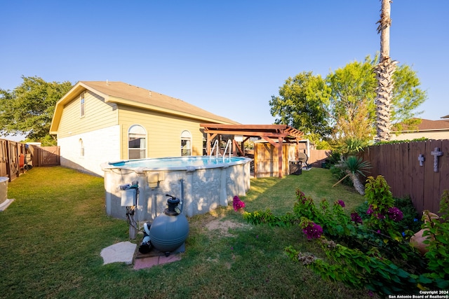 view of yard with a fenced in pool