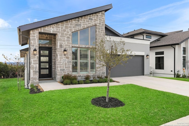 contemporary home featuring a garage and a front lawn