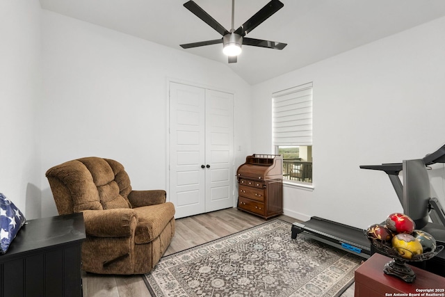 living area featuring ceiling fan and light hardwood / wood-style flooring